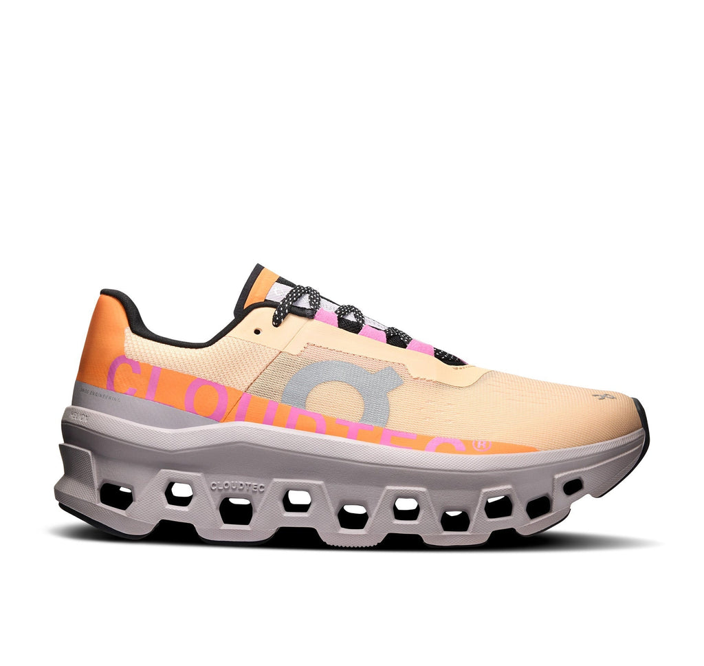 On Women Cloudmonster Orange/Grey Running Shoes product image 1, provided for visual reference and product detail review